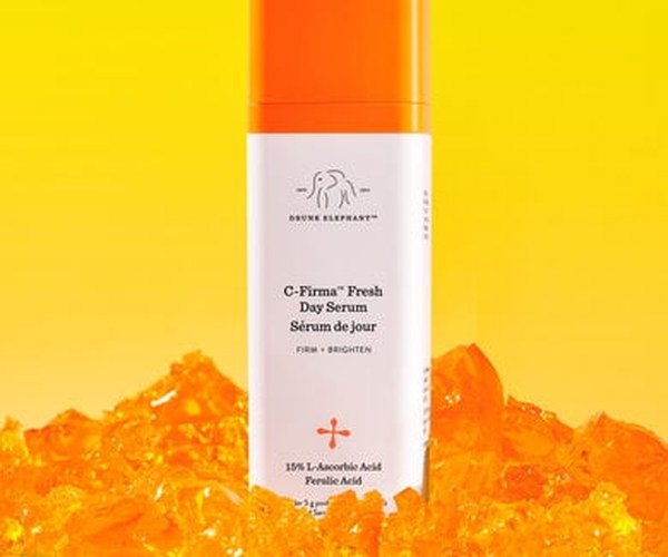 Image of a C-Firma Fresh bottle in front of a yellow background on top of orange rocks ad image